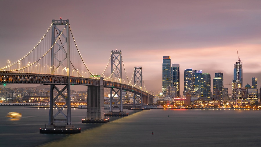 Bay Bridge which includes night scenes, a river or creek and a city