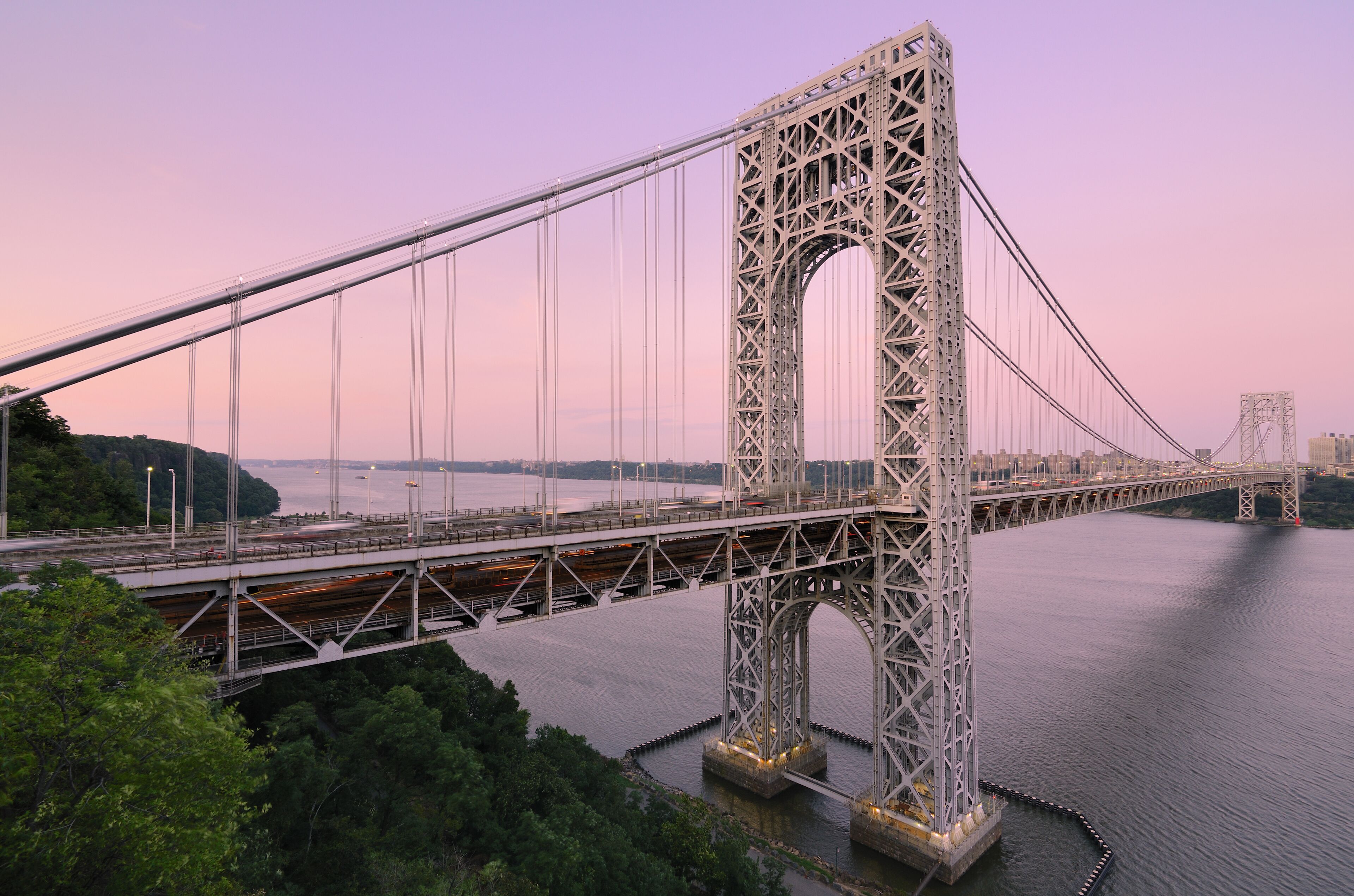 The George Washington Bridge spanning the Hudson River at twilight to connect New Jersey and New York City.
