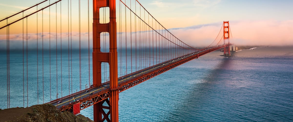 Sunset view of the Golden Gate Bridge and fog from Battery Spencer, Golden Gate National Recreation Area, in San Francisco, California.