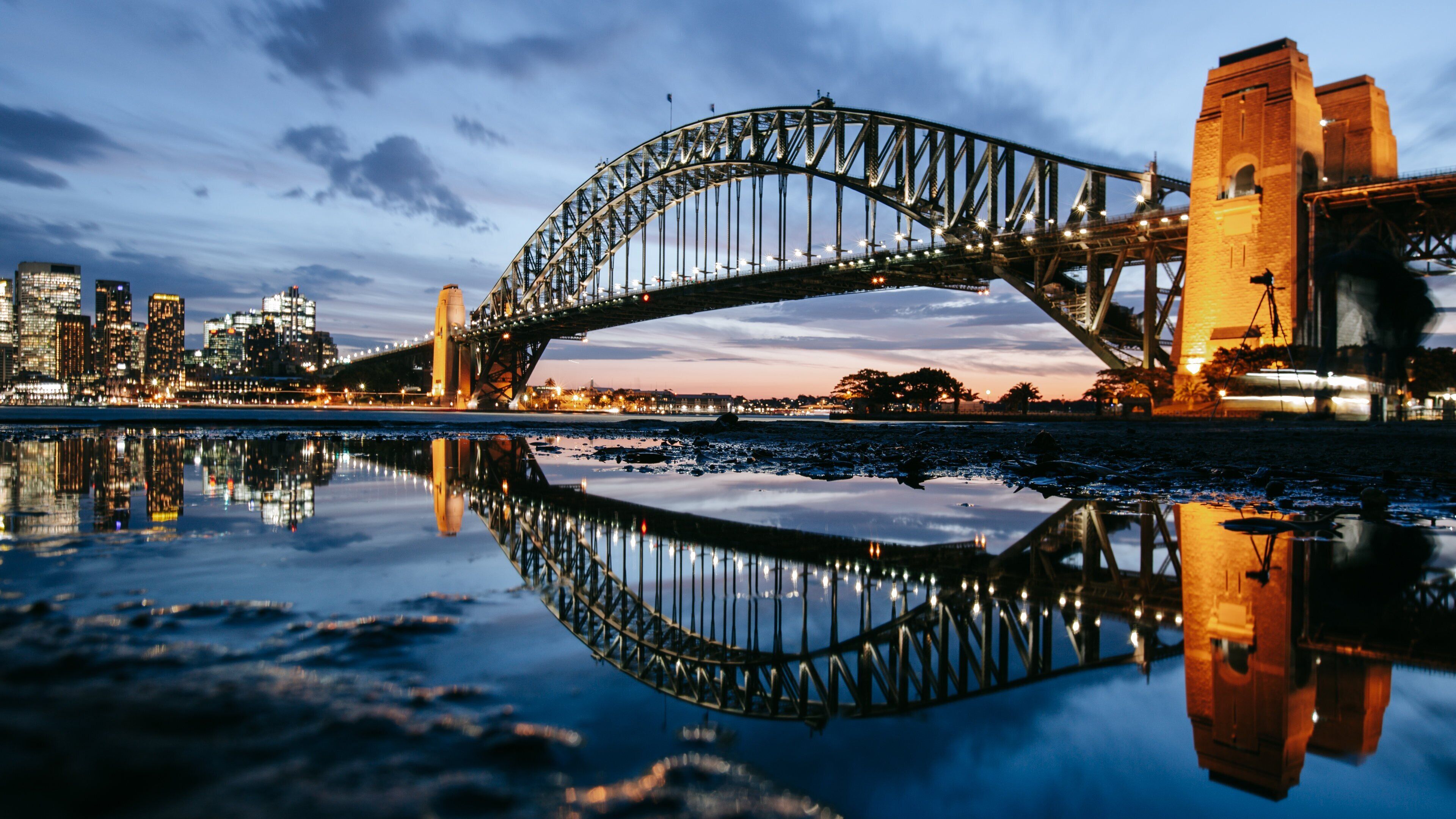 Sydney Harbour Bridge showing night scenes, a bridge and a sunset