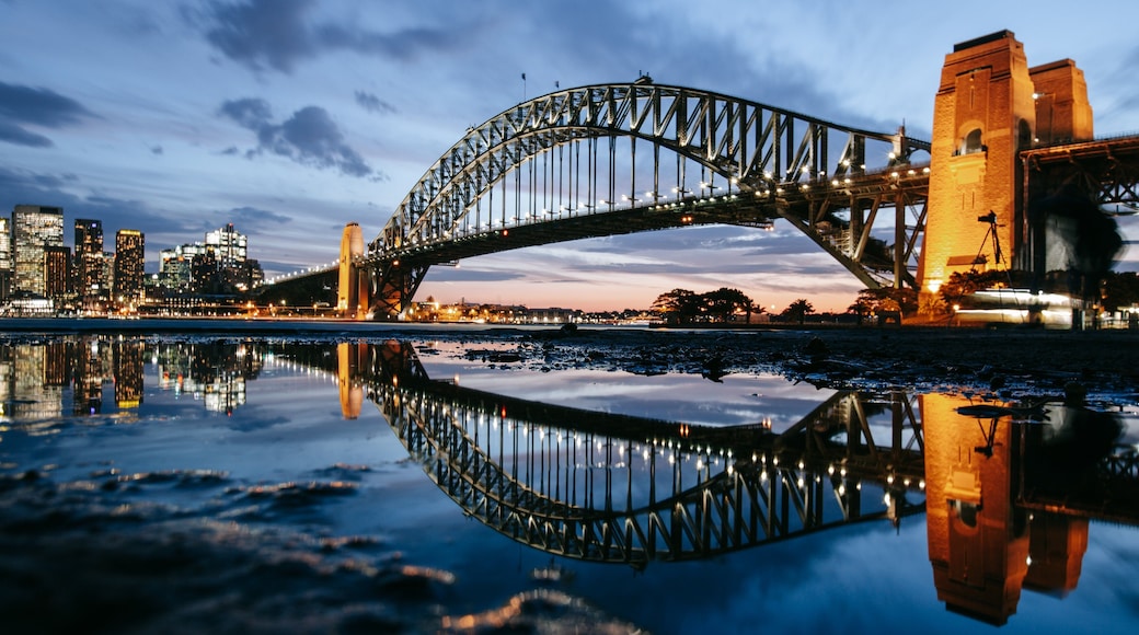 Sydney Harbour Bridge showing night scenes, a bridge and a sunset