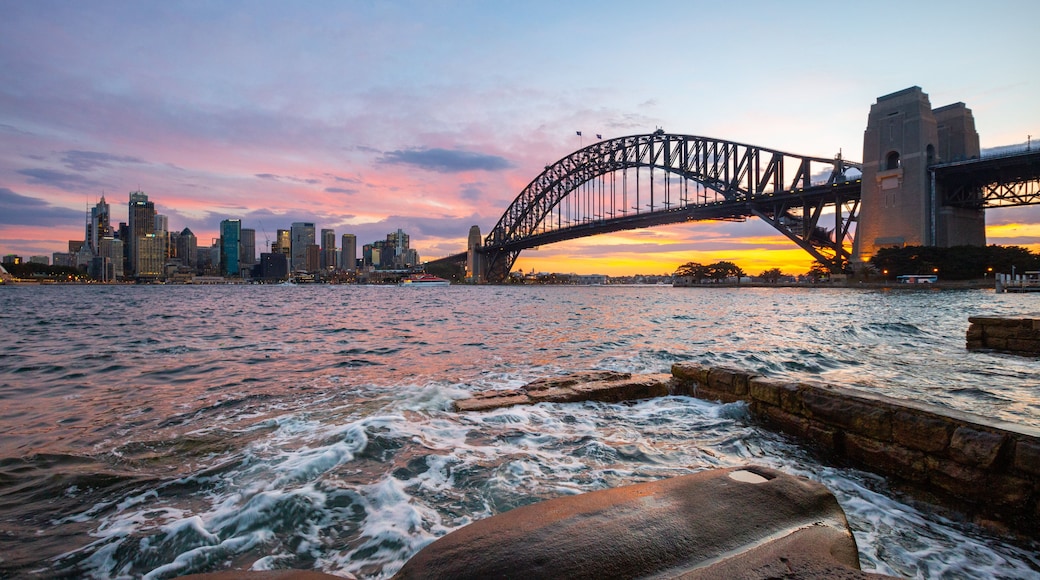 Sydney Harbour Bridge featuring a sunset, a city and a bay or harbor