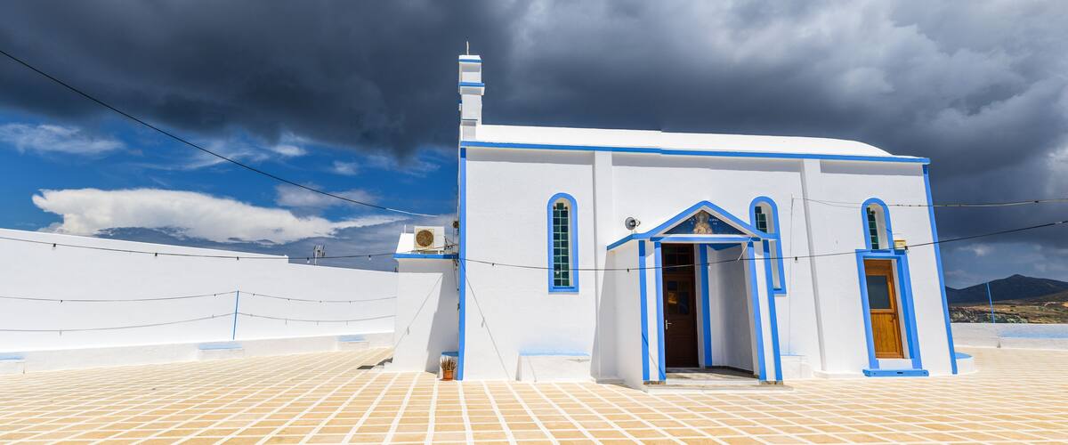 Agia Paraskevi, traditional Greek church located in the center of Pollonia village. Milos island, Cyclades, Greece.