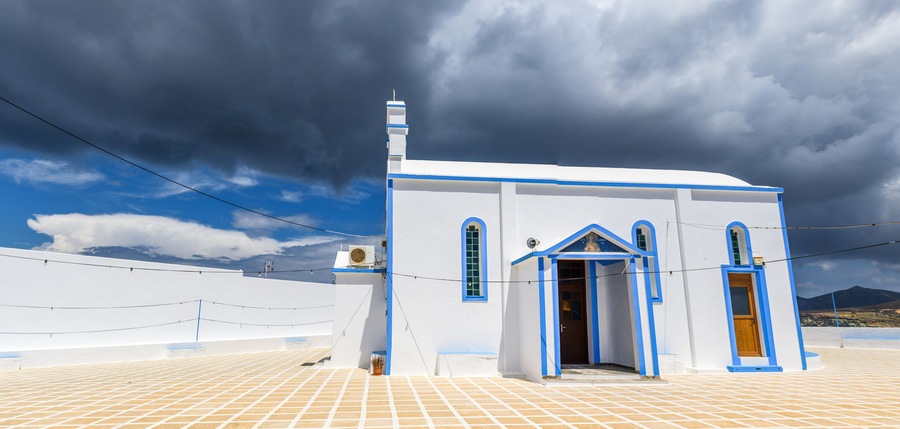 Agia Paraskevi, traditional Greek church located in the center of Pollonia village. Milos island, Cyclades, Greece.