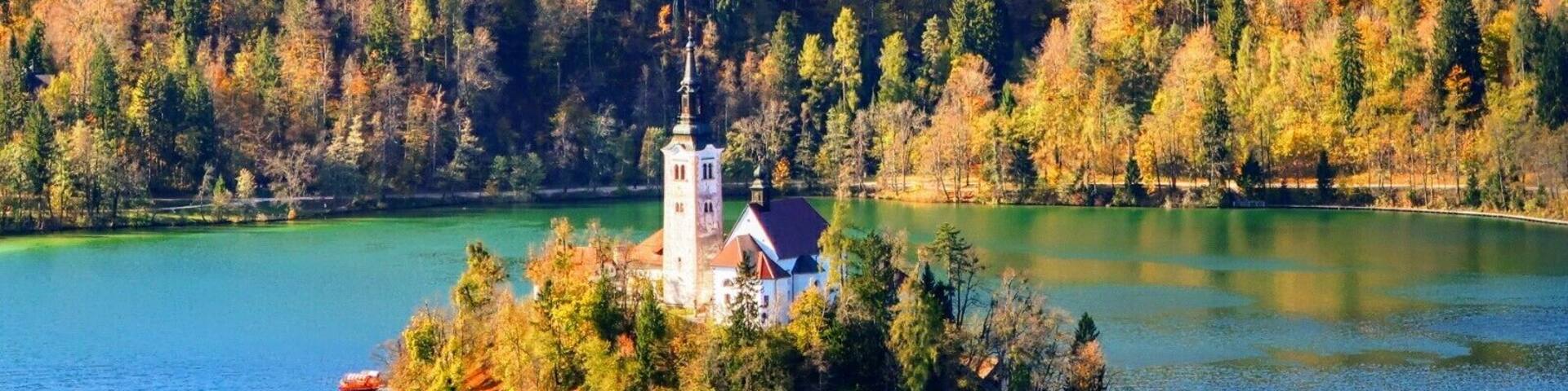 Amazing view of Lake Bled surrounded by the colors of fall