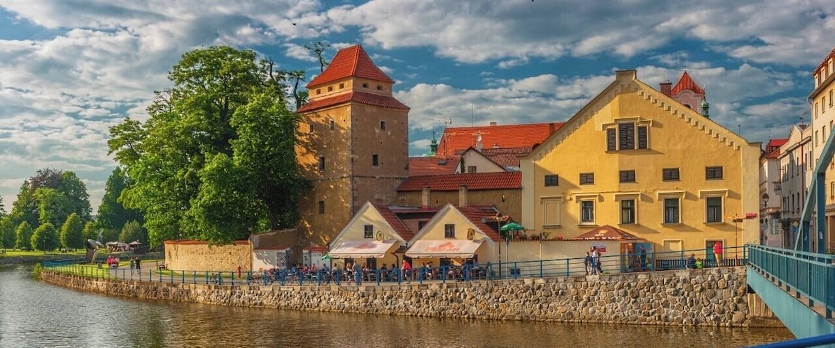 June 2016
Iron Maiden tower, České Budějovice, Czech republic
Iron Maiden (or Železná panna in Czech language, formerly known also as Spilhaybl) is the name of original fortification tower of old town of České Budějovice on the embarkment of river Malše. It is one of only two towers remaining to date (second one is the Rabenštejnská tower). It was built in 14th century and its current design is from 1612. The entrance from the embarkment is dated only from 19th century.
The name of Iron Maiden originates from a legend saying the same torture machine was in there. It should be added that Iron Maiden as a sophisticated torturing machine, usually portraied as a wooden man shaped sarcophagus with sharp spikes or knives inside, is probably a historical hoax and it was actually not used very much. The popular UK heavy metal band was named after this torture device.