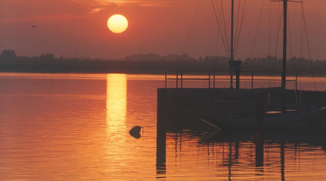 Bregenz which includes a lake or waterhole and a sunset