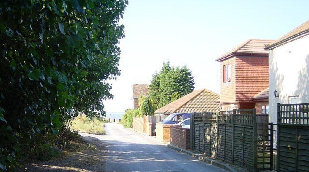 Northern end of Grain High Street. There aren't many roads in Grain and this one ends at the bollards beyond which lies the beach.