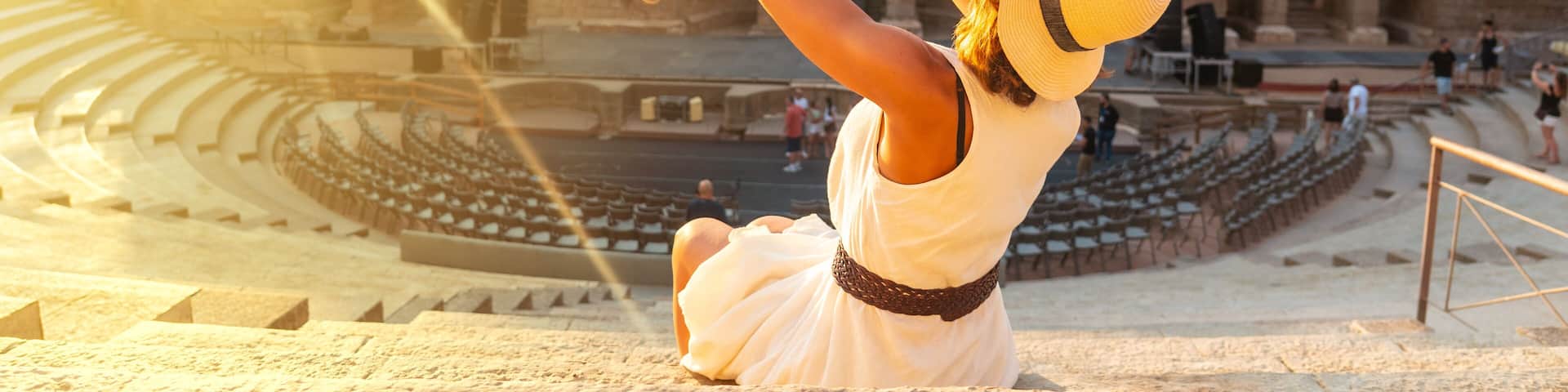 Roman Ruins of Merida, a mother with her baby having fun in the Roman Theater. Extremadura, Spain