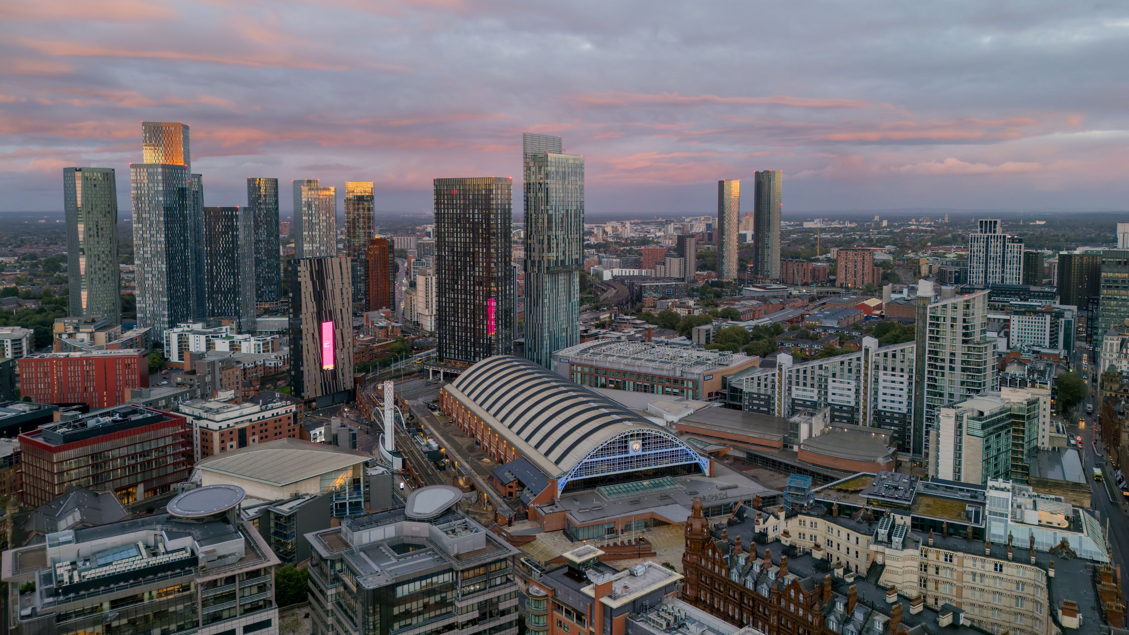 Manchester Central aerial view looking towards Beetham Tower and Deansgate Square, showing the landmark convention centre and modern Manchester city centre skyline.