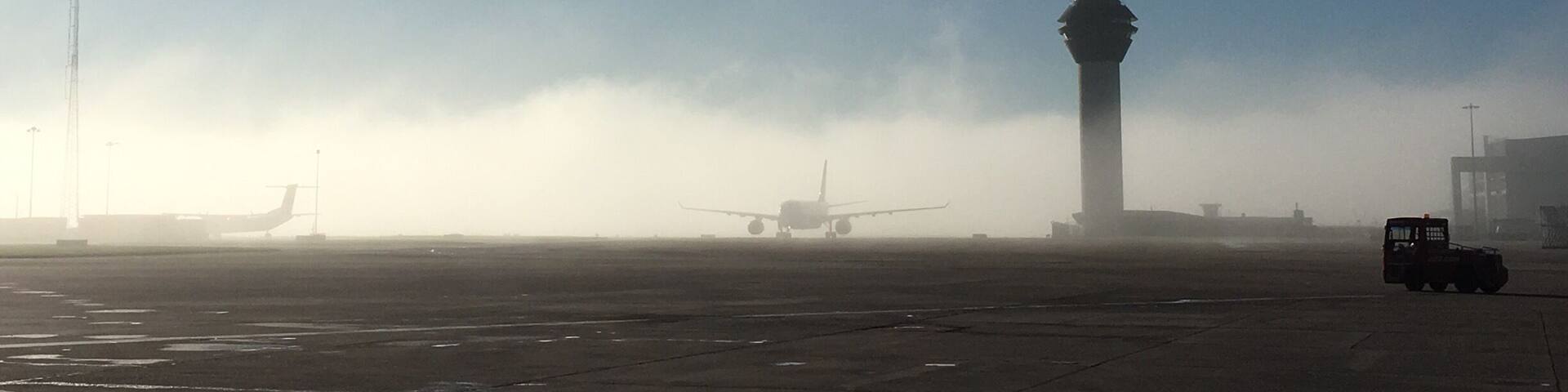 The fog came down so quickly a couple of days ago. Quite eerie to see this plane creeping past ATC tower in the very early morning sun/fog.