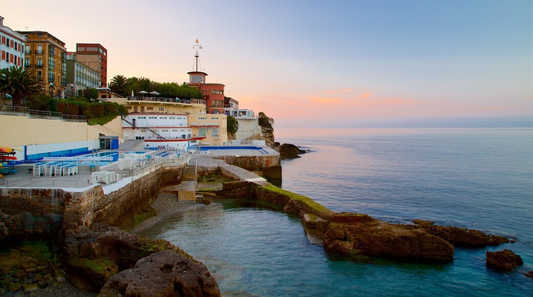 Gijon showing general coastal views, a sunset and a coastal town