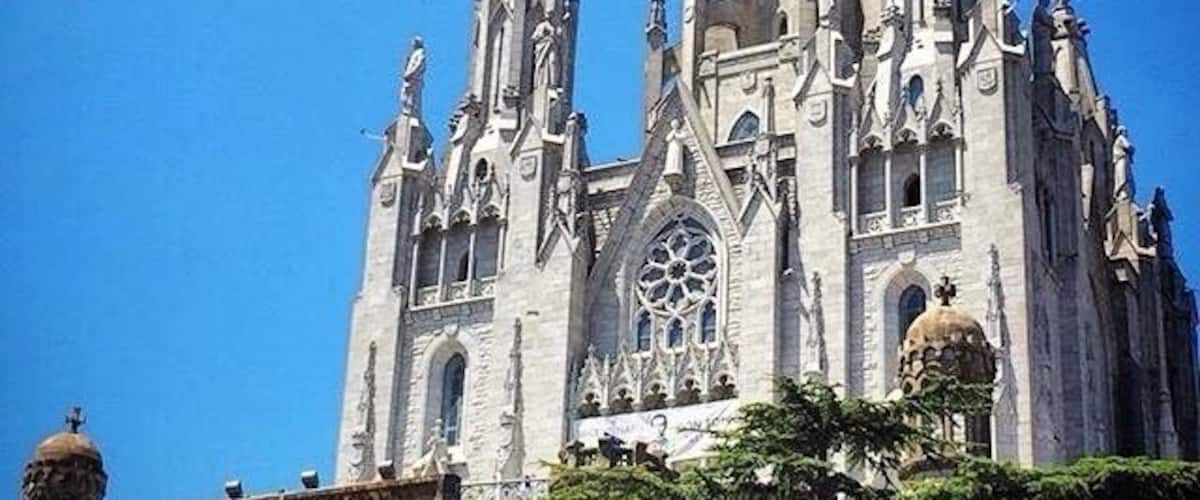 A grand cathedral with intricate Gothic architecture, featuring multiple spires and statues.