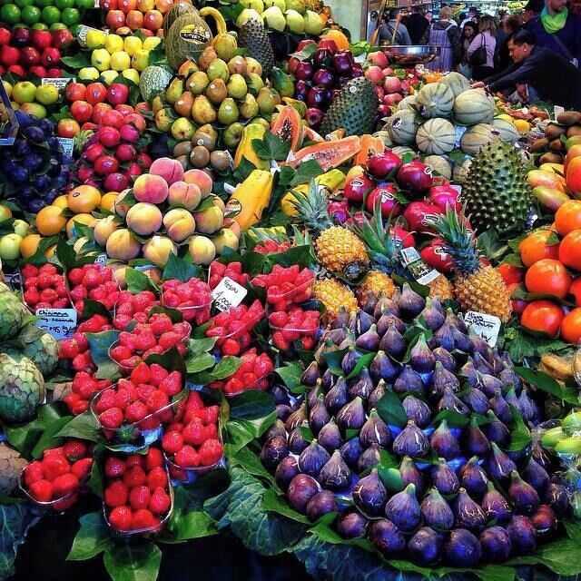 A fruit market with various fruits like apples, bananas, and oranges.