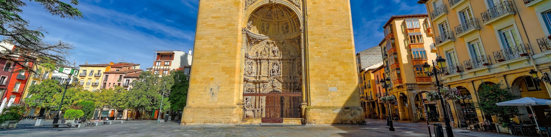 A historic cathedral with two towers and an ornate facade.