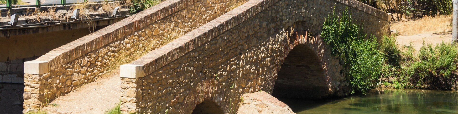 Ancient bridge at Riofrio, on the Frio river, Loja city, Andalusia, Spain.