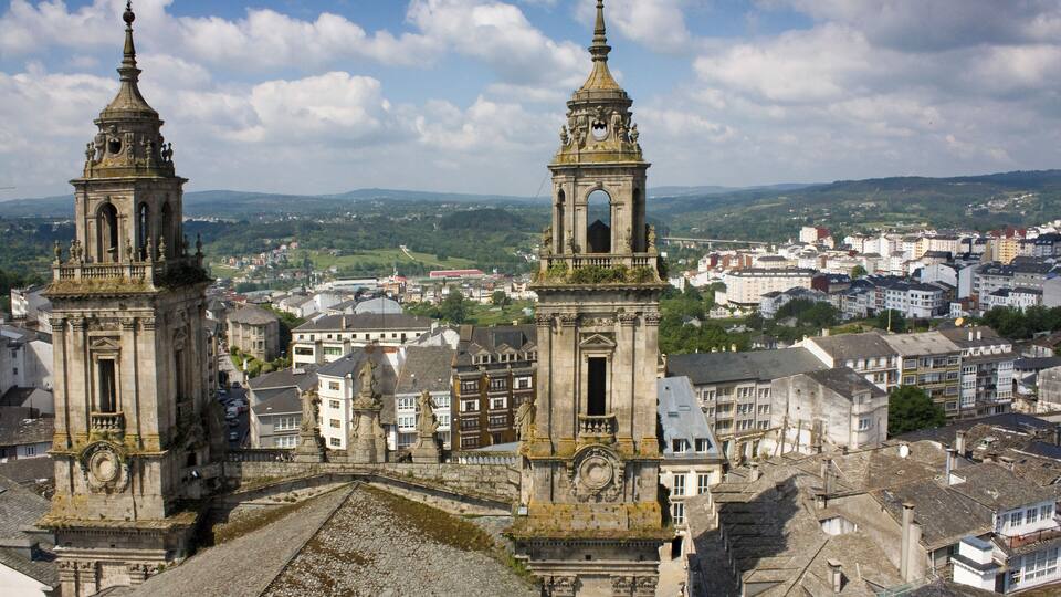 Towers of Lugo cathedral and cityscape.