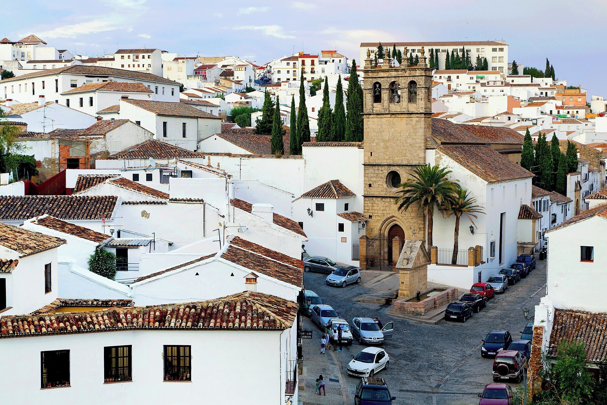A view of Ronda's old Moorish quarter.  In the center of the photo is the 16th-century church of our Father Jesus.  In front of the church you'll find a triangular pediment called the Fuente de los Ocho Caños - or Eight Spouts Fountain.  In the 1700s this was the commercial center of the city, and this large public fountain was built to serve the community.
