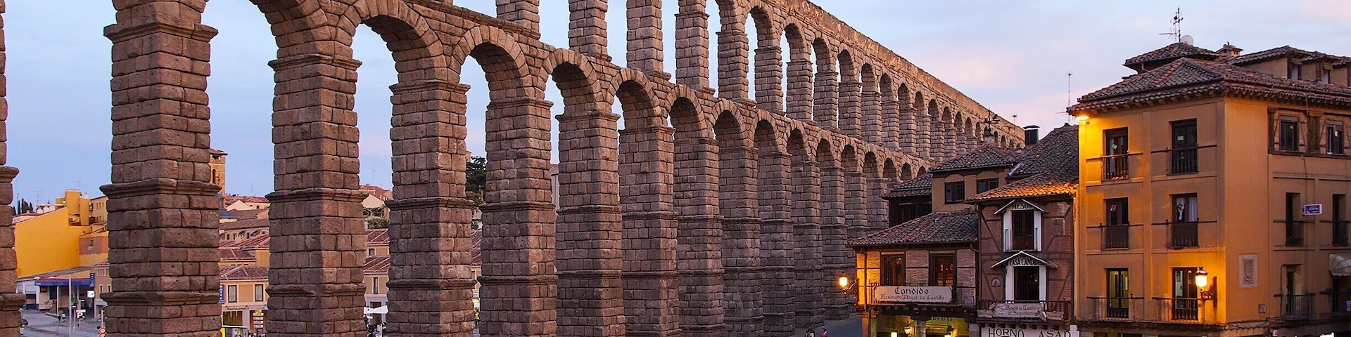 Join the locals during the evening paseo (nightly walk) near the city's iconic 2000-year-old Roman aqueduct. The main action happens at Plaza Azoguejo, which the aqueduct crosses on it's way to the Alcázar. The aqueduct was built to provide the Roman military base here with a steady supply of water from the Fría River, some 9 miles away. It was so well engineered that it continued to supply water until the late 19th century.