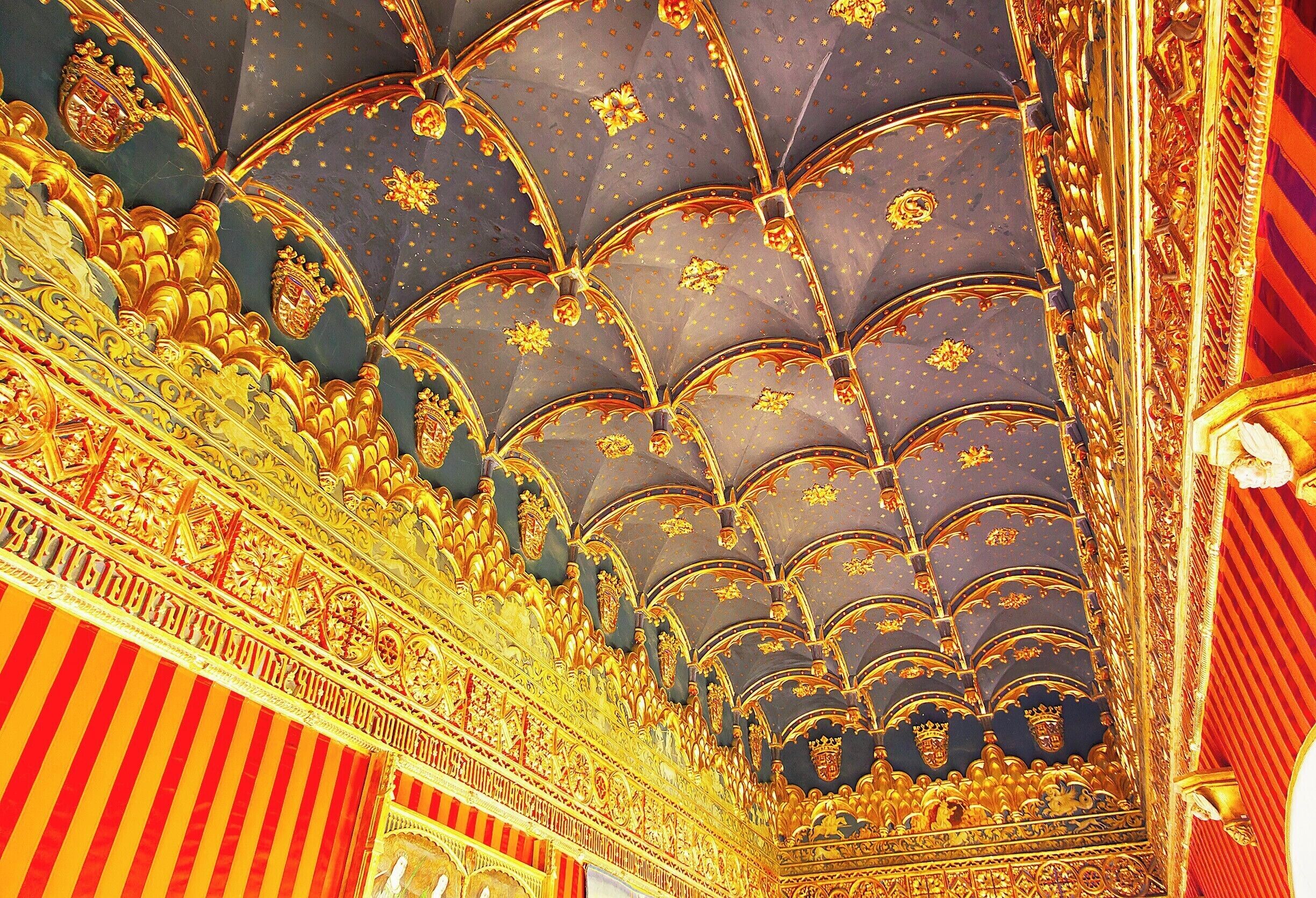 The Sala del Cordón with it's starry night ceiling and striped walls reminds me of a circus tent.  Legend has it that Alfonso X built this room in the 13th-century after he committed blasphemy for excessive pride and a section of the Alcazar collapsed in a storm the following night.  The room was destroyed in the fire of 1862, but was rebuilt based on drawings.