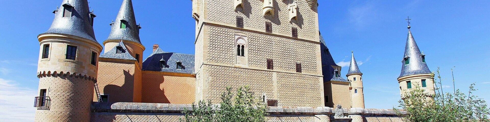 Segovia's castle sits like the bow of a ship at the northwest tip of the city. It's a massive, imposing structure that was added to over many generations. Pictured here is the side of the castle facing the city. The tall, awkward-looking tower in the middle was added by King John II in the early 15th century.
The true beauty of the castle, though, lies with it's interior rooms, which were handcrafted by Arabian workmen (under Christian rule) in the early 14th-century. The attention to detail and the scale of the works rival those found at the Alhambra and the AlcĂĄzar of Seville. Well worth the entry fee just to wander the rooms.