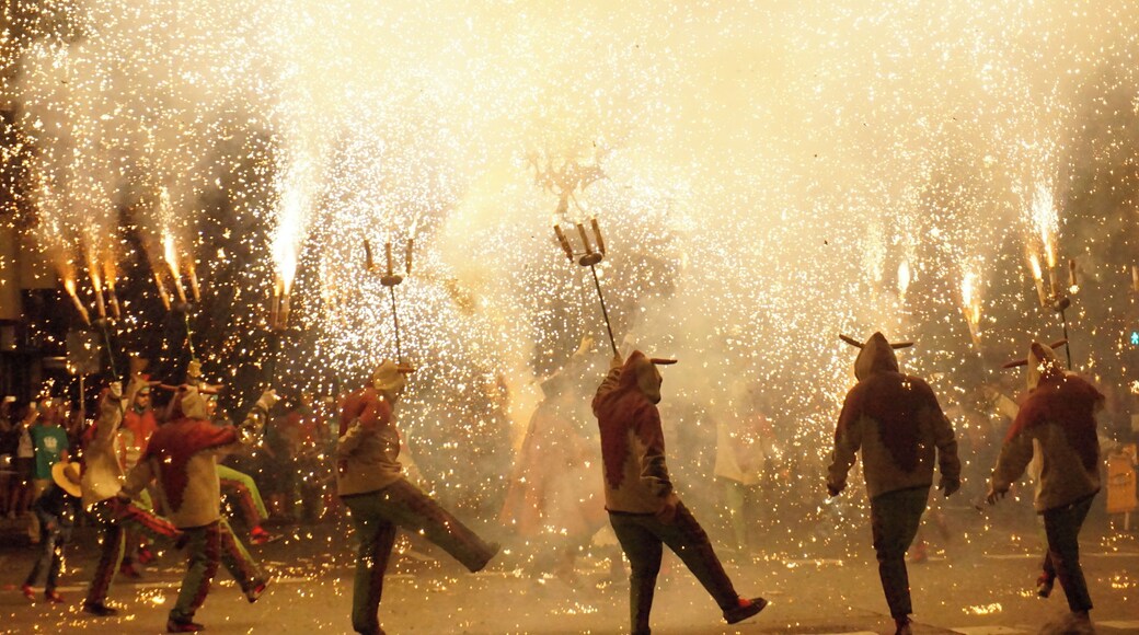 Correfocs, fire runners, are a tradition from Catalonia, Valencia, France, etc. Men, women, children run through the fireworks while dancing or playing the drums. Dressed as devils, usually there's a main character, a dragon, a demon, etc, in the center of the dance. This photo was taken in Tarragona, ancient roman Tarraco, in Catalonia.