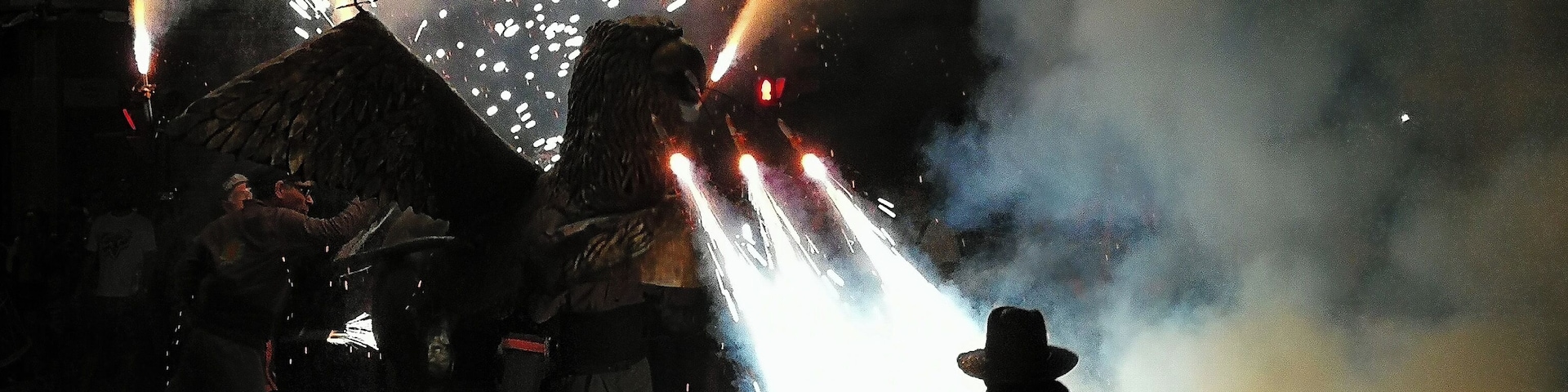 A little boy dares the fire while dancing in front of a dragon of fireworks in Tarragona following the popular tradition of Correfocs (fire runners) for Sant Joan's Day #culture