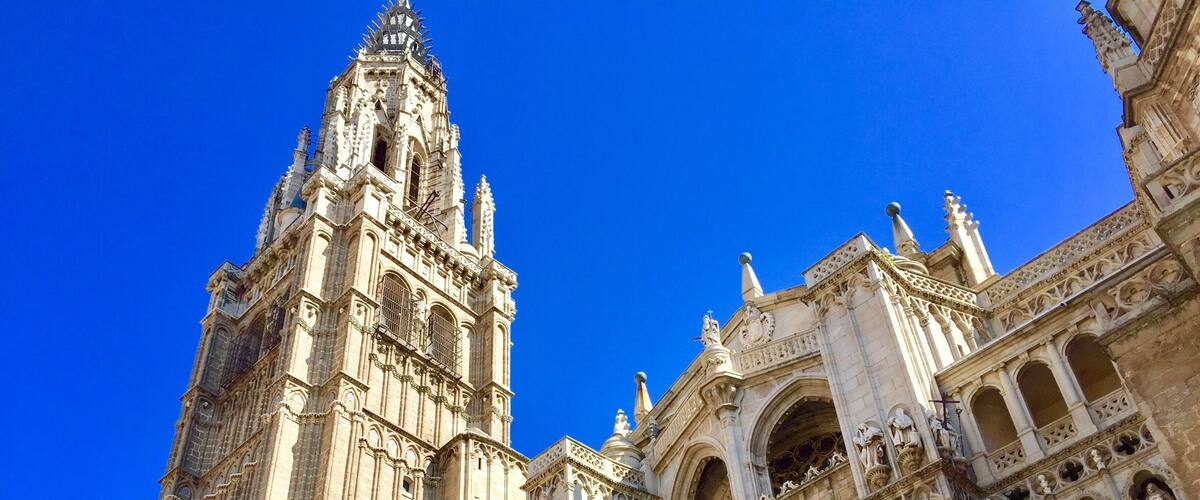 A Gothic cathedral with intricate stone carvings and a tall spire.