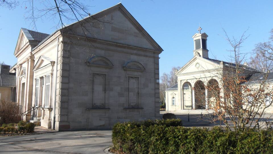 A historic church with a bell tower and a classical facade.