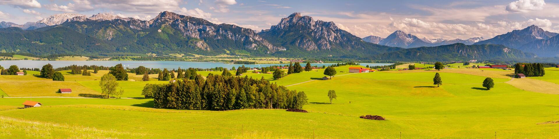 panoramic scene with rural landscape and mountain range in Bavaria, germany
