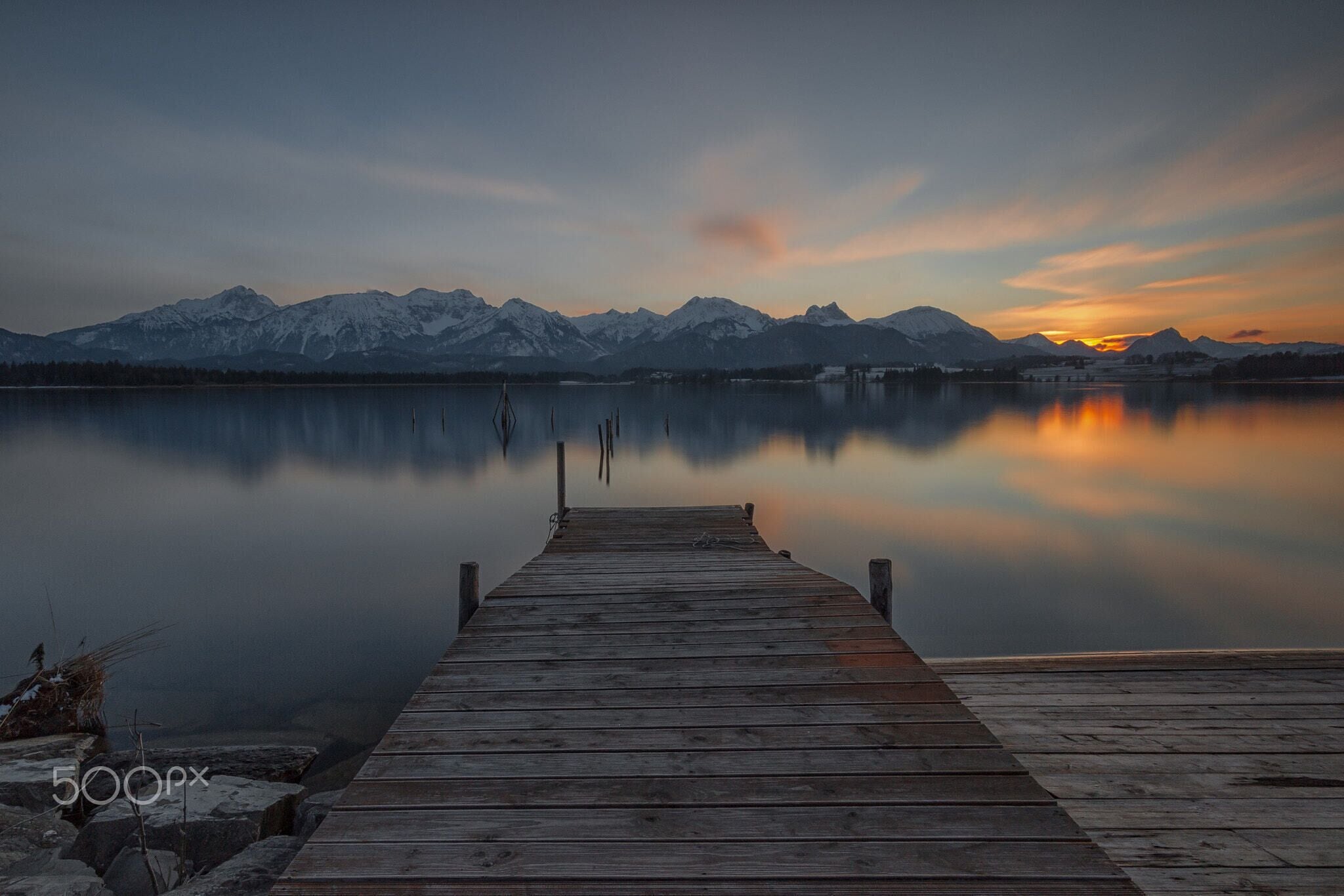 500px provided description: Stille Momente [#bootssteg ,#Sonnenuntergang ,#Schnee ,#Wasser ,#Alpen ,#Berge ,#Wolken ,#Holz ,#Steg ,#Allg?u ,#Hopfensee]