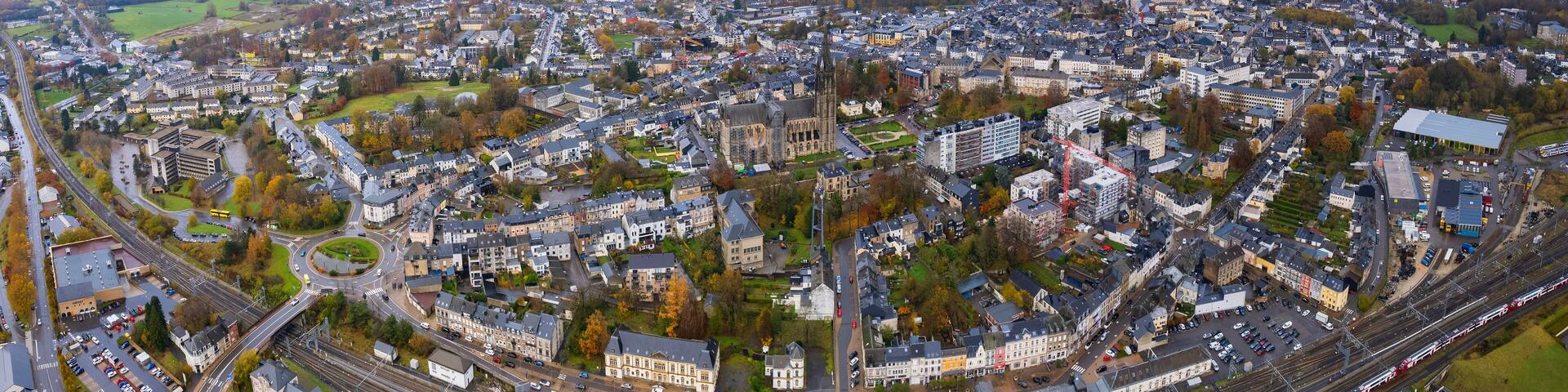Aerial around the city Arlon in Belgium on a cloudy afternoon in later fall.
