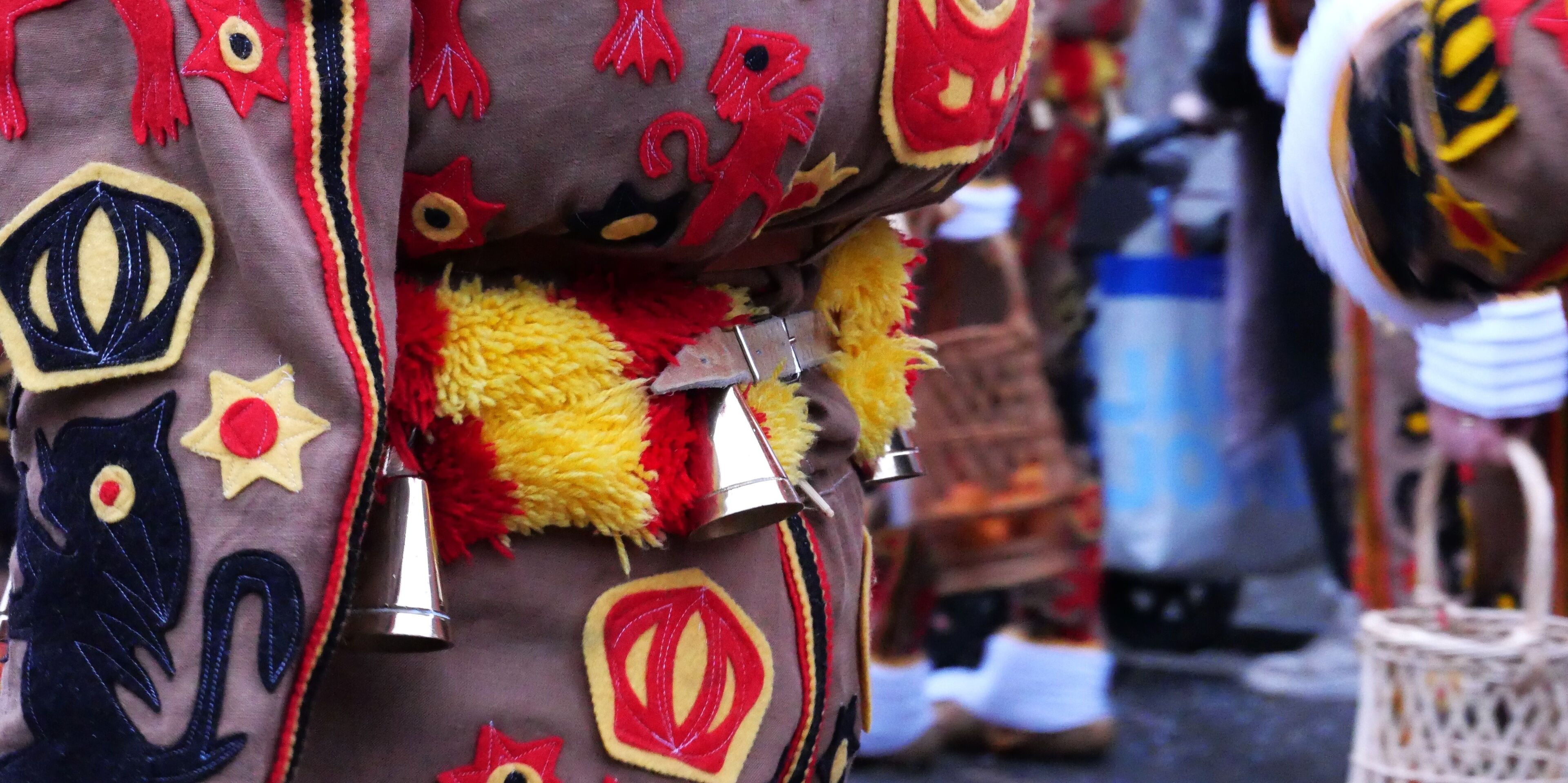 A close-up of a traditional costume with intricate patterns and decorations.