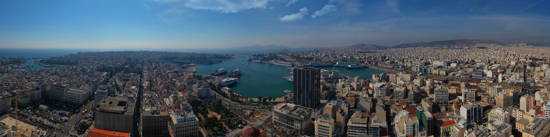 Aerial drone panoramic photo of famous busy port of Piraeus one of the largest in Mediterranean, Attica, Greece