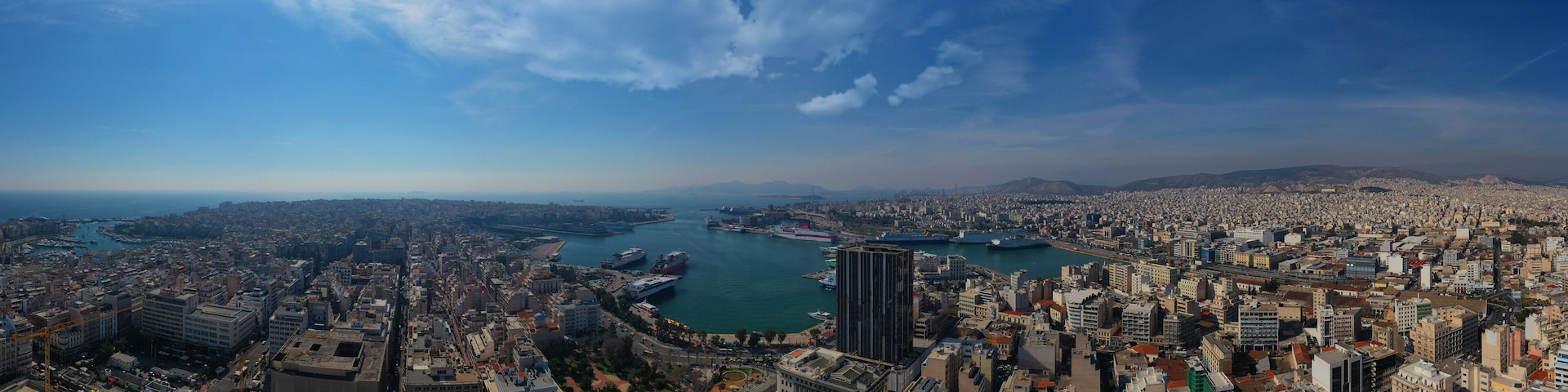 Aerial drone panoramic photo of famous busy port of Piraeus one of the largest in Mediterranean, Attica, Greece
