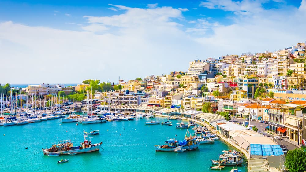 Panoramic view of Mikrolimano with colorful houses along the marina in Piraeus, Greece.