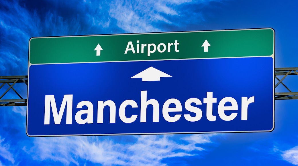 Road sign indicating direction to the city of Manchester