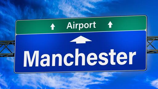Road sign indicating direction to the city of Manchester