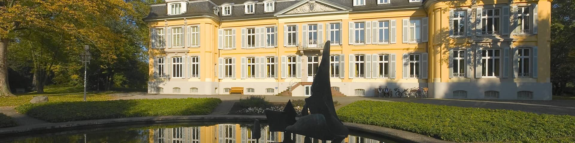 Leverkusen featuring heritage architecture and a pond
