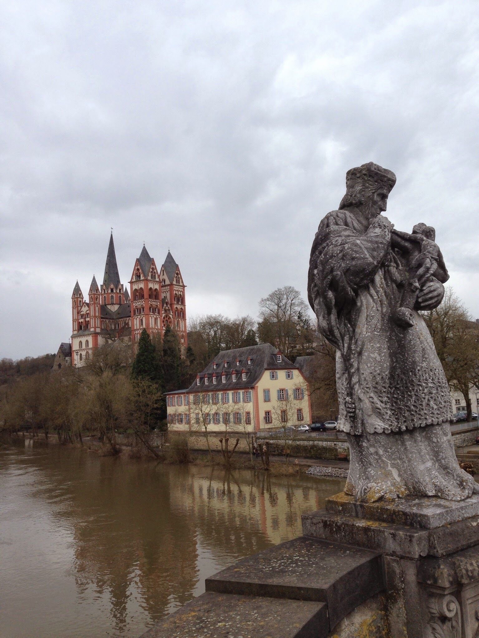 A castle, a statue, and a river.