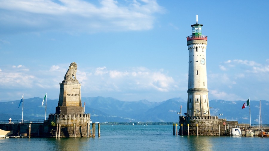 Lindau featuring a statue or sculpture, a lake or waterhole and a lighthouse
