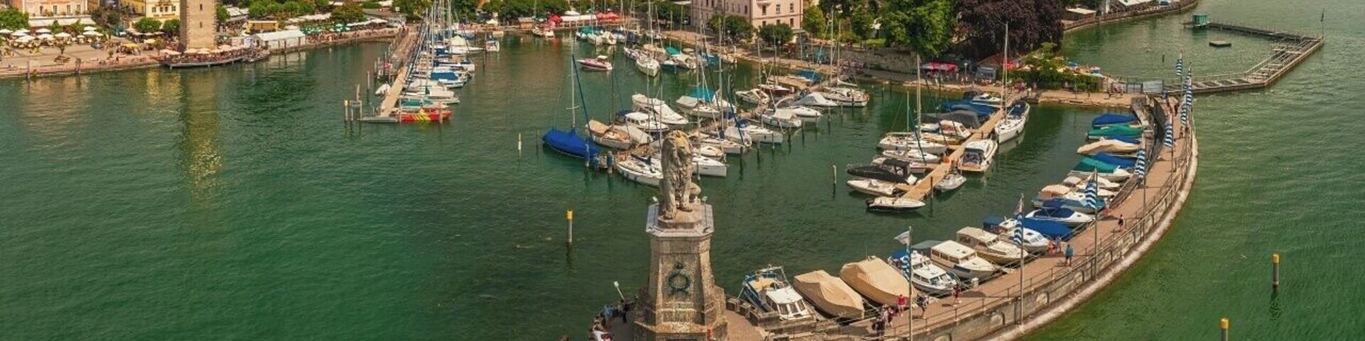 July 2016
Lindau, Old Town harbour, Bavaria, Germany
Lindau is a historical town in Bavaria land of Germany on the eastern side of Lake Constance (Bodensee in German) near the borders of Austria and Switzerland. The coat of arms of Lindau town is a linden tree, referring to the supposed origin of the town's name (Linde means linden tree in German).
Lindau was established in 1275 century as one of the Imperial Free Cities. Historically, the trading route from Nuremberg to Italy passed through Lindau; fishery has also played a big role in the economy of the city and in the 19th century, Lindau was an important location for textile industries. Tourism (including restaurants and accommodation) and industrial production are the main industries in contemporary Lindau.
The historical Old town was built on a small island with a harbour and you can enjoy this picturesque view from the lighthouse opposite the statue of Bavarian lion. You get to Lindau via highway from Munich to Bregenz (Austria).