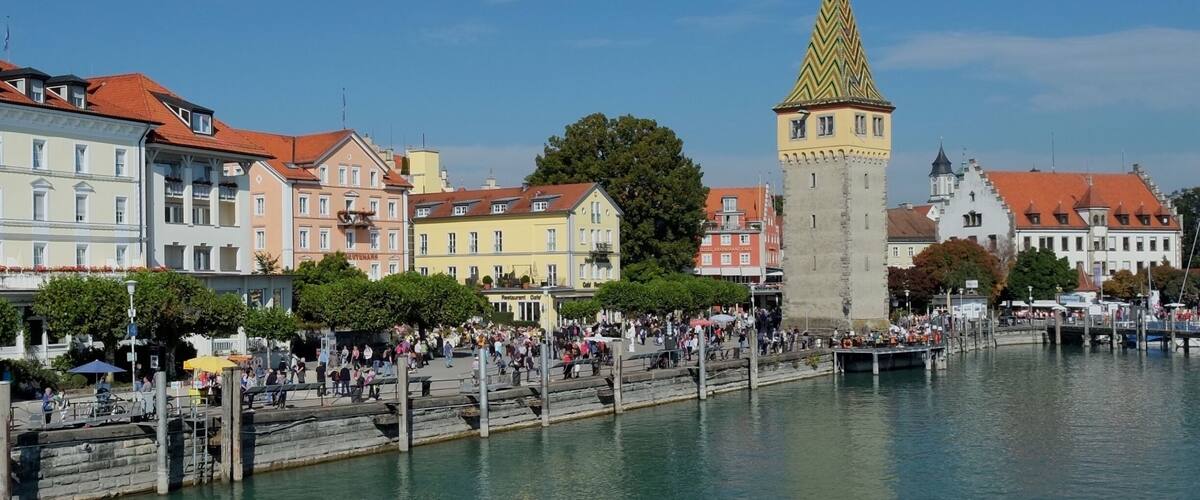 Lindau is a town on Lake Constance or Bodensee in Bavaria, Germany, known for its old town on Lindau island. The harbor has a Bavarian Lion statue and a stone lighthouse with lake and mountain views. On the harborfront Seepromenade, the 12th-century Mangturm is a former watchtower with a pointed, tiled roof. Near restaurant-lined Maximilianstrasse, the Gothic Altes Rathaus (Old Town Hall) has a painted facade.