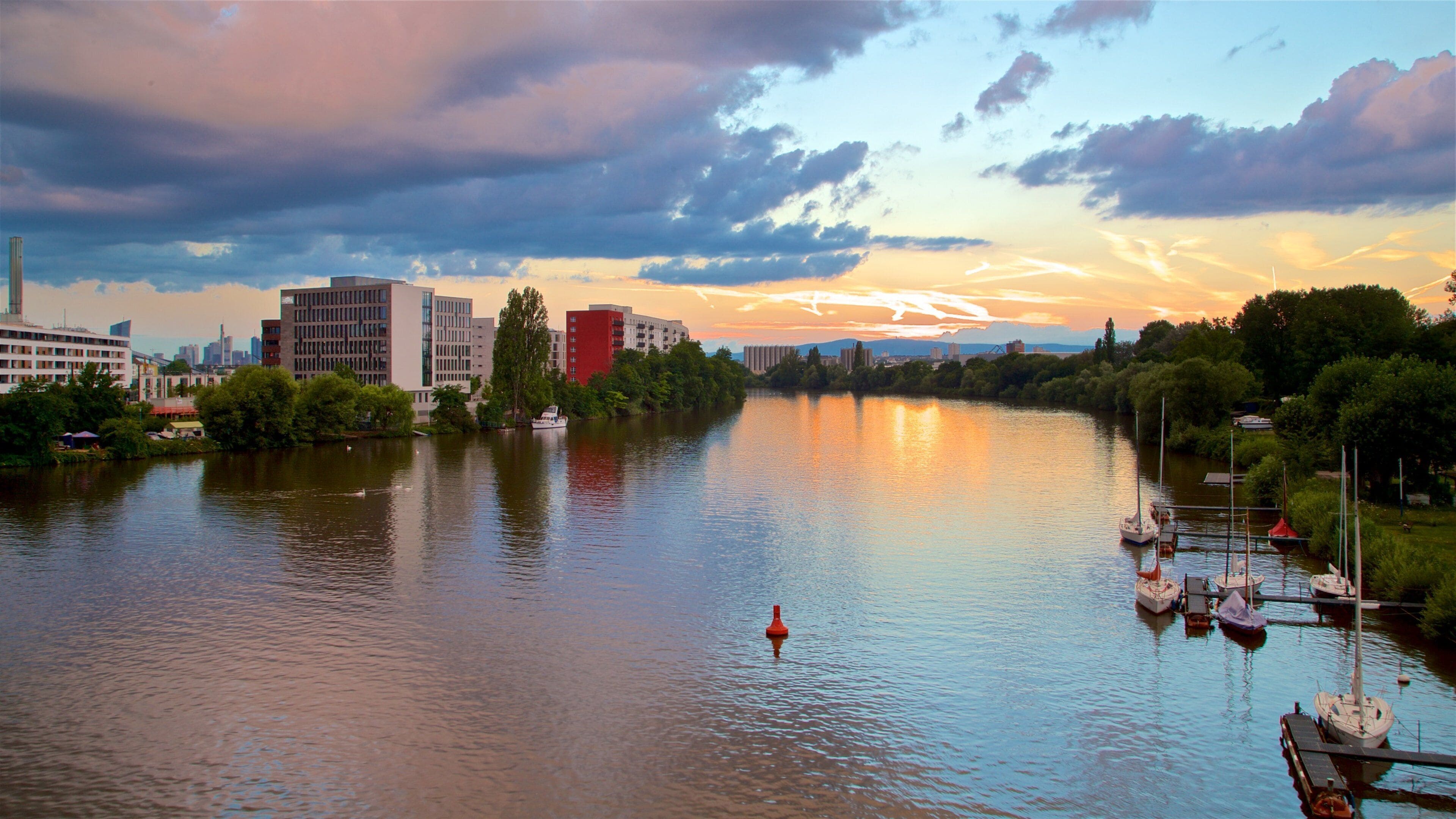 Offenbach am Main showing a river or creek, a city and a sunset