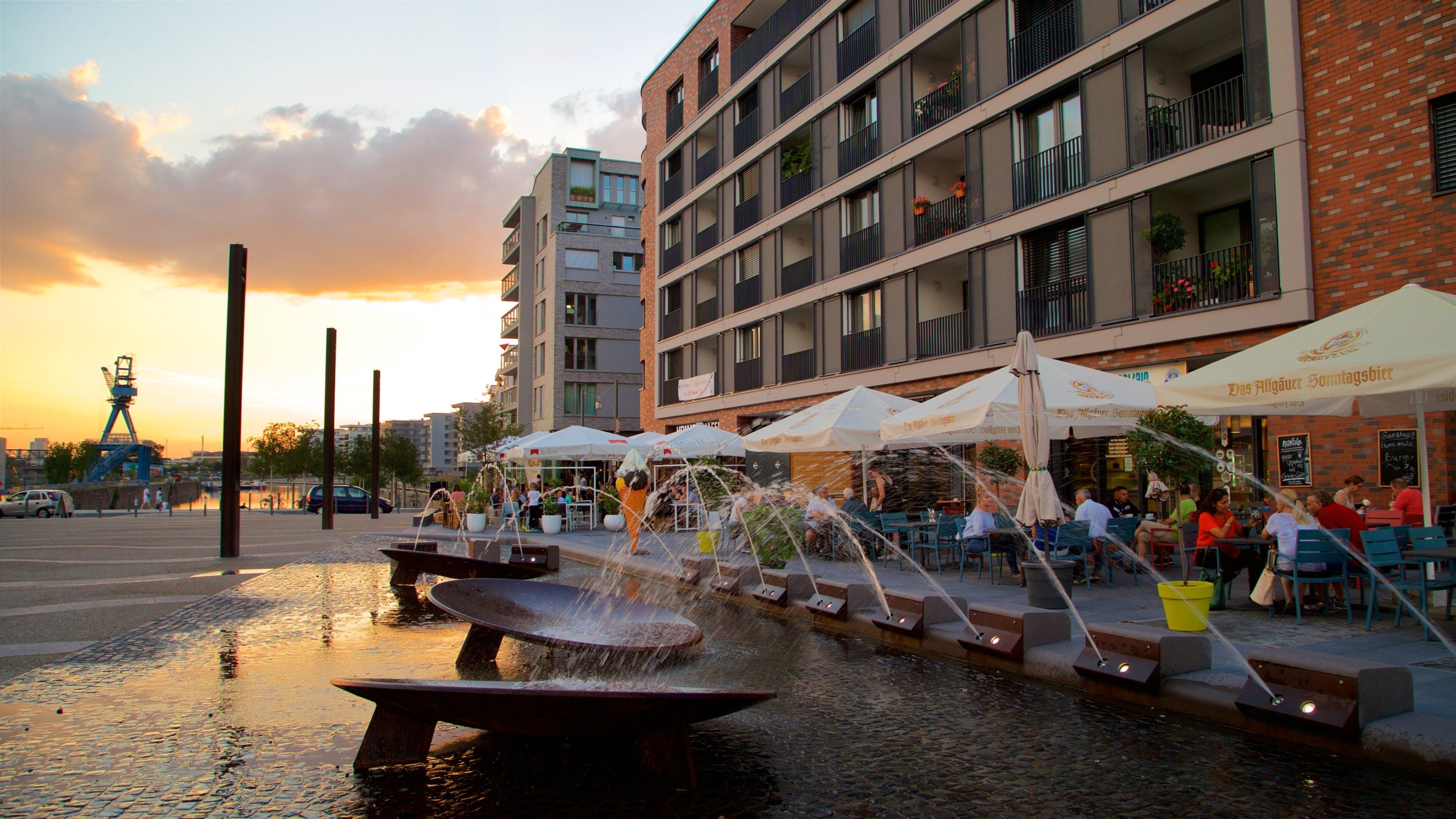 Offenbach am Main which includes a sunset, outdoor eating and a fountain