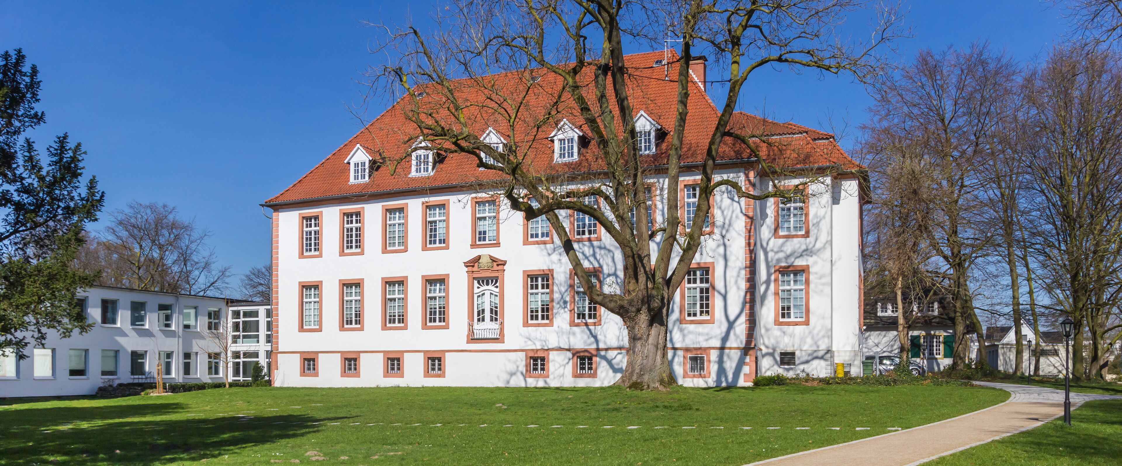 Panorama of park and historic mansion Reckenburg in Wiedenbruck, Germany