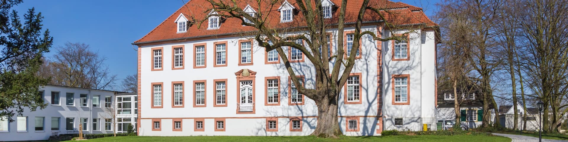 Panorama of park and historic mansion Reckenburg in Wiedenbruck, Germany