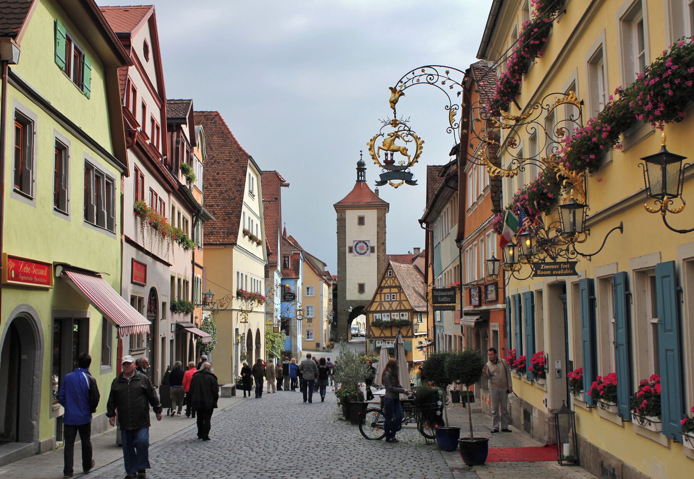 Rothenburg ob der Tauber on the Romantic Road is a world wide symbol of German romance. Artists have long taken inspiration from the unique location of this medieval town whose skyline with its 42 gates and towers is quite unmistakable. Nestling amidst beautiful, unspoiled countryside and still with a largely intact walkable town wall with medieval fortifications surrounding the historic center, Rothenburg with its winding alleyways and artistic treasures is the ideal place to relax.