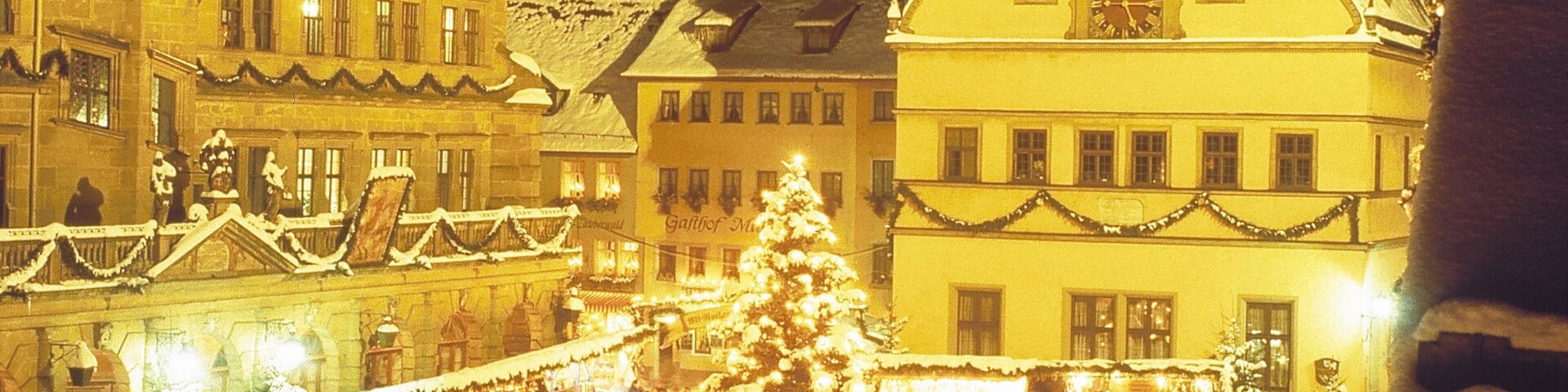 Rothenburg ob der Tauber featuring snow, night scenes and a square or plaza