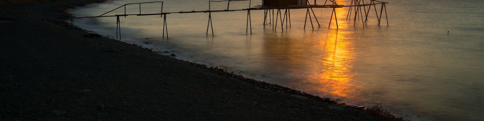 Morning at the famous fishing dives of Tekirdag province. The view of the traditional fishing harbor at sunrise. Ucmakdere beach, Marmara Sea. Turkey